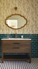 A playful mix of tile and floral wallpaper embellishes the bathroom.