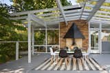 The generous rooftop patio has an original fireplace and a vaulted pergola.