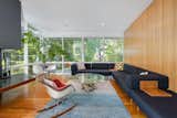 In the second living room, Hemlock paneling provides a warm backdrop for furnishings.