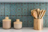 A handmade tile backsplash speaks to the home’s midcentury origins.