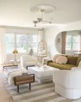 Sculptural-yet-soft furniture picks in the living room complement the new arched motif throughout.