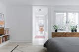 New windows, lighter floors, and crisp white walls lighten up the interior dramatically. Greenery NYC also redesigned the courtyard, making sure to leave a decorative screen from the 60s in a nod to the building’s history.