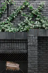 A closer view of how the steel planter integrates with the newly painted brick fireplace.