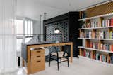 It was important to ensure that the writer’s work space connect seamlessly with the rest of the apartment. The built-in shelving echoes the library shelves downstairs, and the white oak desk, designed by e.g. Projects, is consistent with the white oak cabinetry throughout. The top is wrapped in leather, in a nod to traditional writer’s desks.