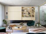 “The main living spaces, flowing from the central courtyard, fold down with the stepped concrete floor,” says Fox. “Plywood joinery and an off-form concrete ceiling anchor and harmonize.”