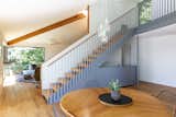 SHED opened up the stairwell to connect the living and dining rooms, and enable sightlines between the upper and lower floor.