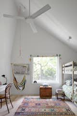 The new bedrooms in the addition have a playful ceiling treatment. "We took advantage of the shape of the building to give them a whimsical ceiling form," says VW.