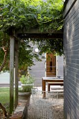 Mature vegetation helps the new yard feel more settled.