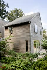 A view showing how the addition meets the original home. The exterior is clad in a European-style rain screen, a new product to the couple that they now recommend to clients. "We were eager to try out stuff and get to experiment a little bit in our own house," says Catherine.