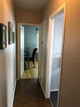 Before: There was a short hallway with built-in storage and many different flooring choices, an accumulation of past changes to the home.
