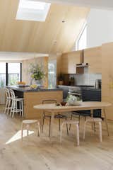 The ceilings are highest in the kitchen, which creates a very "active" space, says Nwankpa Gillespie, for everyone to gather around the 4-by-10-foot island. Skylights and custom angled windows usher in natural light without allowing the neighbors to see in, and draw the eye up to the angled ceiling. "I think those windows created a punctuation and rhythm to the space," says Nwankpa Gillespie.