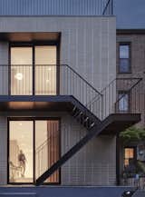 Neufeld chose brick for the addition so it related to the existing house, but wanted to underscore the temporal contrast between the two parts of the building. “Let new be new, and old be old,” says Neufeld. The switchback layout of the slim-lined steel staircase doesn’t encroach on the yard.