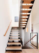 "People like to go towards the light," says Levy, noting that the way the sun cascades down the stairs naturally draws people to walk up them towards the living spaces.