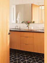 Fireclay Tile’s “Hexite” pattern covers the floor in the primary bathroom.
