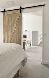 Likewise, a sliding door at the entrance to the bedroom saves space.