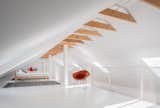 Carie uses the loft for a variety of purposes: watching TV, practicing yoga, or an extra guest bed when needed.