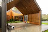An Undulating Roof Flows Across the Barn-Like Modules of a Striking Long Island Home - Photo 3 of 13 - 