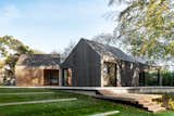 An Undulating Roof Flows Across the Barn-Like Modules of a Striking Long Island Home - Photo 12 of 13 - 