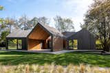 An Undulating Roof Flows Across the Barn-Like Modules of a Striking Long Island Home - Photo 2 of 13 - 