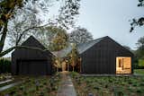 An Undulating Roof Flows Across the Barn-Like Modules of a Striking Long Island Home - Photo 1 of 13 - 
