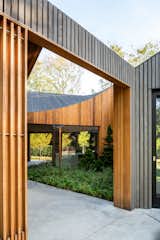 An Undulating Roof Flows Across the Barn-Like Modules of a Striking Long Island Home - Photo 5 of 13 - 