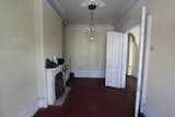 Before: A small receiving room at the front of the house made the narrow footprint feel segmented.