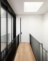 A glass wall to the courtyard and a skylight admit all the natural light.