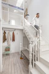 Architect Alessia Mosci and her partner bought this two-floor flat in a 1903 Edwardian building in London with the intention of fixing it up and reusing as many materials as possible. The stair volume was opened up to its full height, and the original stairs and floorboards kept and refinished.