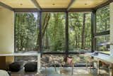 Floor-to-ceiling glass allows guests to appreciate the forested lot as much as the owners do.