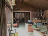Before: The previous floorplan was much more segmented, with the dining room pushed back under a lower ceiling, and the kitchen unseen behind a solid wall.