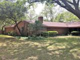 Before: In 2018, Blake and Rob Eagle bought this midcentury home in Abilene, Texas, located in the neighborhood where they grew up, and where their families still live. At purchase, the exterior had several different finishes, including brick, stained wood, and painted wood, and many of the windows were quite small. The couple’s remodel preserved the footprint and basic shape of the house, while tweaking the floorplan.
