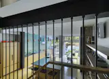 The metal rod construction keeps the sight lines generous and visually connects the two floors.