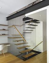 The staircase design was dictated by the need to let the light in – and spread it to the cellar below, which has now been finished into a children’s playroom. The staircase is suspended from the structural supports above it. “Engineers always write to me about this stair, because they're like, ‘Whoa, I can't believe you did that without stringers or anything like that,’” says Kaplan. “Because it's the opposite of how you'd ever normally design a stair.”