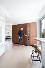 A pantry is tucked inside the “Flatiron” sculpture, in part also inspired by 1950’s Italian furniture designed by Gio Ponti. Thanks to this treatment, there are now easy sight lines between the kitchen and living room.