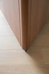 A close-up of the rounded corner of the triangular millwork.