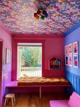 In her daughter’s room “She’s a Wildflower Wallpaper” from Lust Home joins a different color on every wall, all from Sherwin Williams, including “Blue Lapis,” “California Lilac,” “Spring Azalea,” and “Deep Carnation.” The ceiling light is from Sazerac Stitches.