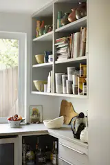 The pantry keeps kitchen essentials close at hand but out of sight of the main rooms.