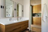 Custom cabinetry runs from the closet into the bathroom for a unified feel.
