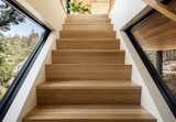 Windows along the new staircase connect the family to the outdoors, and allow more natural light inside.