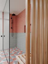 In the shower, the slat wall feeds into a convenient bench.
