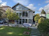 The new three-story addition faces south, bringing generous light all the way to the front of the house.