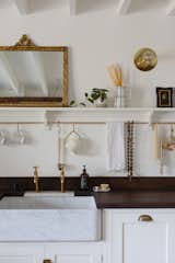 A DeVol marble sink and faucet are lit by Ramsey Conder 8