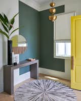 The home now has a designated foyer, which Joshi-Gupta color-blocked with Farrow and Ball’s “Green Smoke,” to “create a sense of grounding and scale,” says the interior designer.