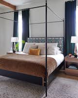 A custom bed from the New Orleans-based Doorman Designs has fabric by local artist Amanda Talley.