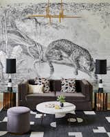 In a flex room that can be used as both guest space and office, Joshi-Gupta placed a large-scale jaguar wallpaper mural with a velvet sofa and Jonathan Adler lighting.