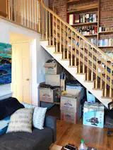Before: The space under the stairs was already used for storage by the homeowners, but not in a way that felt cohesive.