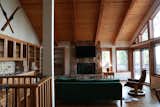 Before: The living room was streamlined dramatically, with the extra storage on one wall removed, and the fireplace façade transformed. The designers also redid all of the millwork, so it doesn’t distract from the view through the twelve-foot-high windows.
