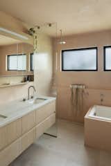 Boyer added the primary bathroom, with a surprise wrap of pink plaster on the walls and ceiling.