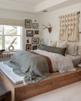 The bedroom is home to a platform bed that Curtis built herself and has since moved from house to house.