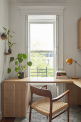“He spends a lot of time in this room, so it had to really work for him,” says Cuttle of Andrew’s office. To maximize the workspace, they designed a white oak corner desk that extends across the window, but doesn’t block the light.